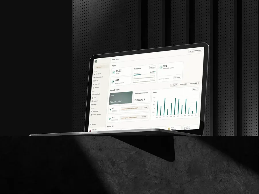 The MountainGreen dashboard on a laptop: plants held and reserved, sales by month, pending commissions and a participant’s referral link